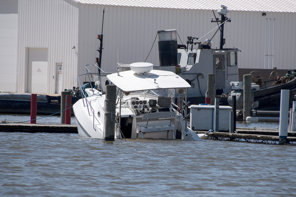 White,Power,Boat,Sinking,In,Marina,Slip